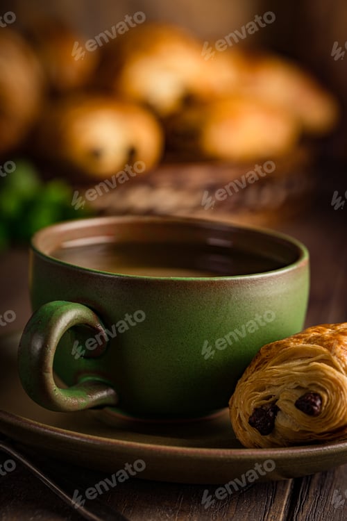 Preview: Green cup of tea with mini chocolate bun