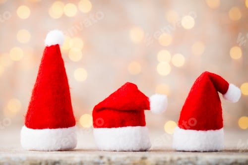 Preview: Three Santa hat. Christmas decoration.Gray background.
