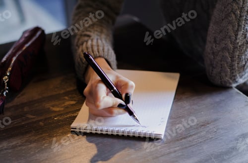 Preview: Girl writes in a notebook. Business woman. Real woman
