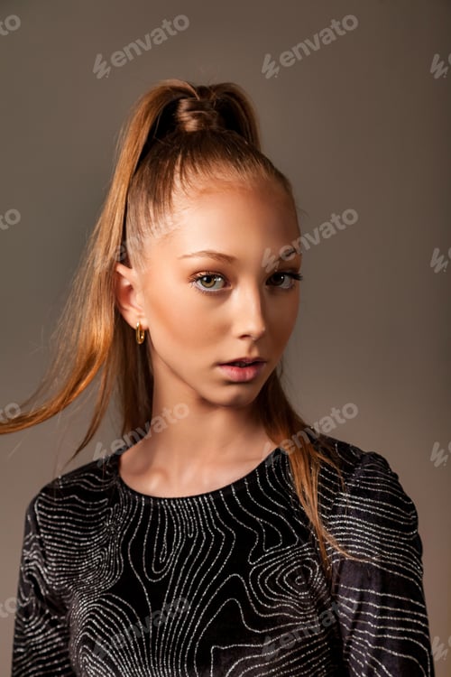 Preview: Portrait of perfect teen cover girl 13 year old posing at gray, closely looking at camera