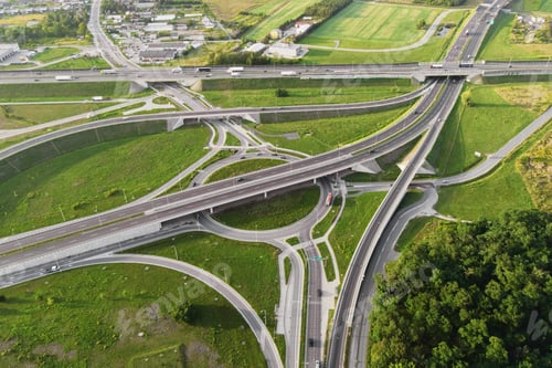 Preview: Cars moving on transport road junction in city, aerial view