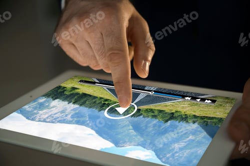 Preview: Man touching tablet screen to play video, closeup