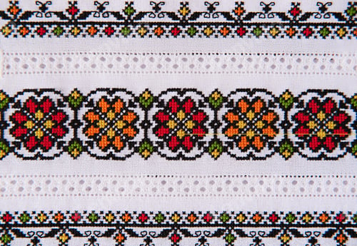 Preview: Slavic cross stitch by colored threads. Design of ethnic pattern. Background with Embroidery Texture