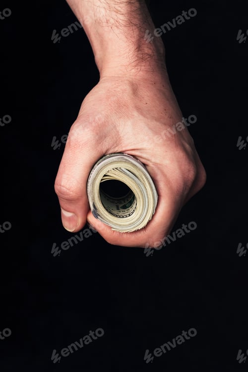 Preview: Roll of hundred us dollars in male fist