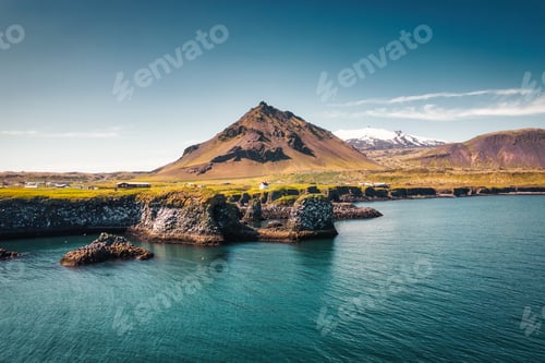 Preview: Arnarstapi fishing village with nordic house and stapafell mountain on coastline