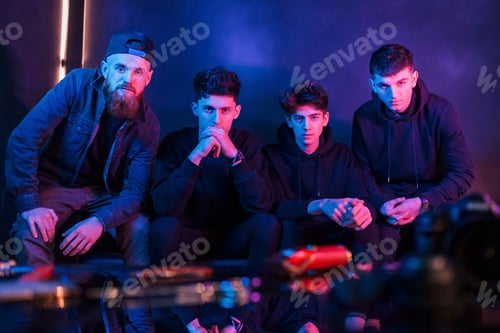 Preview: Group of people is together in the studio with futuristic neon lighting