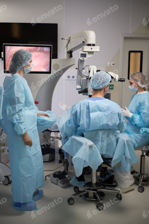 Preview: Multiethnic Medical Team Performing Surgery in Modern Operating Room