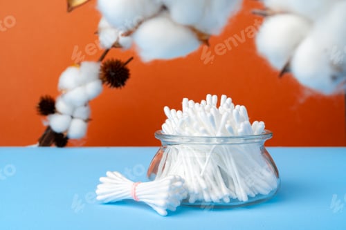 Preview: Set of cotton buds sticks on blue paper