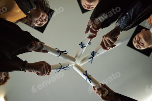 Preview: Multiethnic Young Graduates Holding Diplomas and Celebrating Achievement