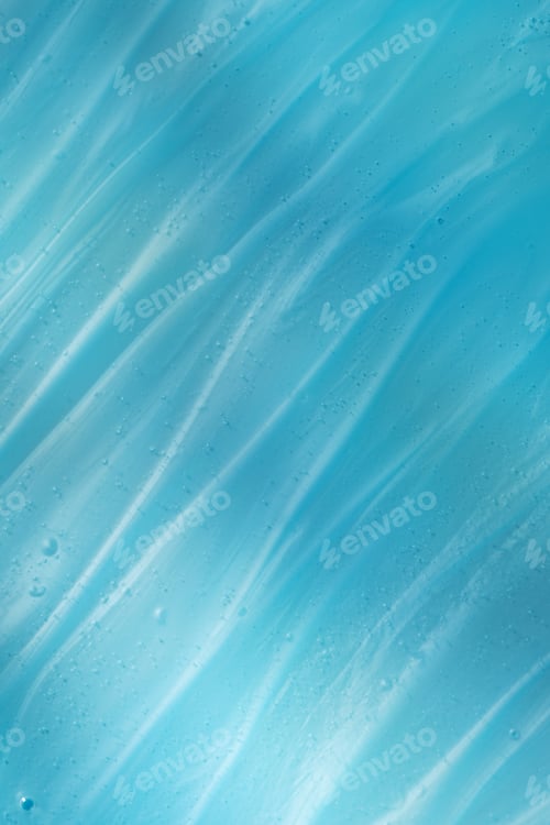 Preview: The texture of a transparent gel on a blue background. Swatch. A sample of a cosmetic product.