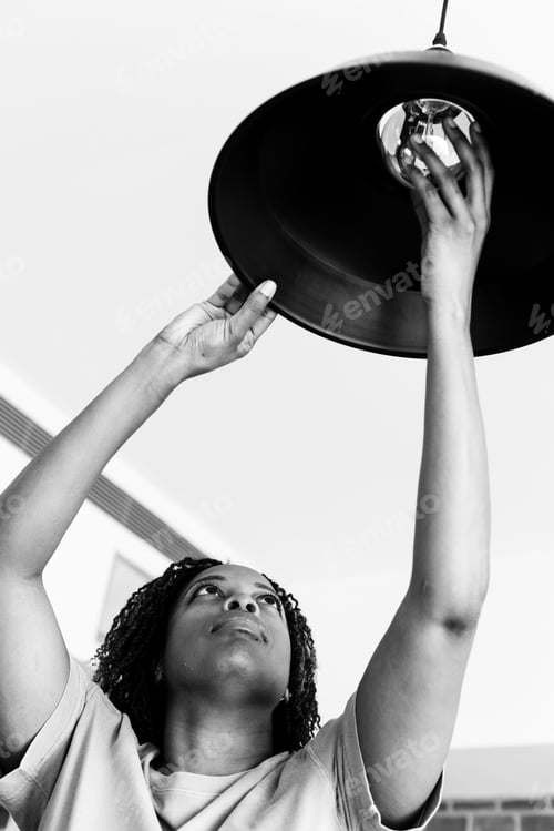 Preview: Woman changing lightbulb