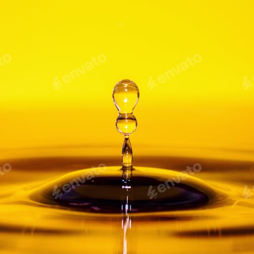 Preview: Macro shot of water droplet on a vibrant yellow background