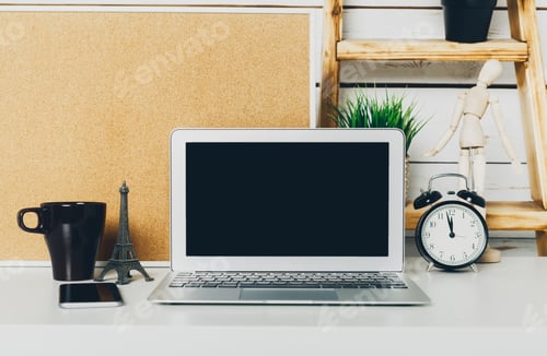 Preview: Open laptop on office table with stationery close up