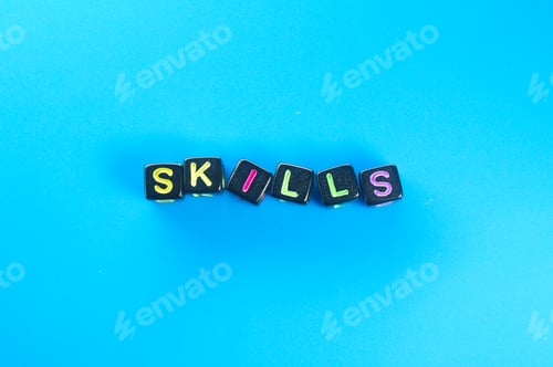 Preview: small black cube with the word skills. skill concept