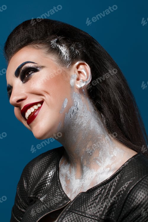 Preview: Girl With Creative Make-Up On A Blue Background