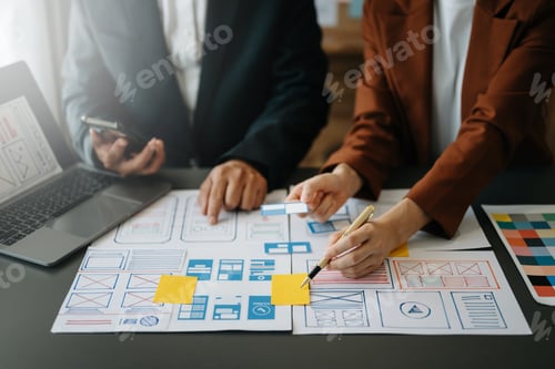 Preview: UX developer and ui designer brainstorming about mobile app interface wireframe