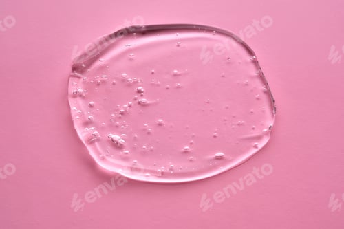 Preview: The texture of the cosmetic gel on a pink background.