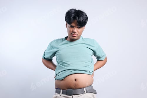 Preview: Funny Young Man Showing Big Belly