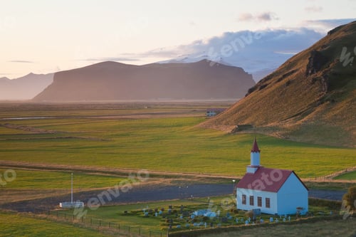 Preview: Small traditional white church near Vik, in a valley.