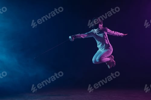 Preview: Fencer holding rapier and jumping on black background with smoke and lighting