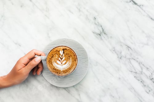 Preview: Foamy Latte on White Marble Counter