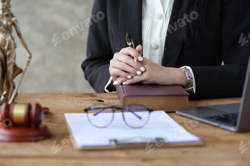 Preview: Female lawyer in law firm contract documents the terms of the legal agreement and waiting to be sign