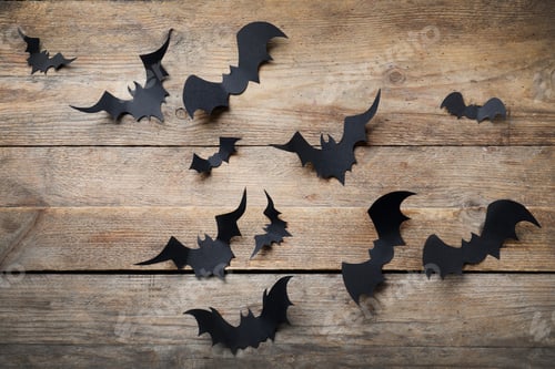 Preview: Paper bats on wooden background, flat lay. Halloween decor