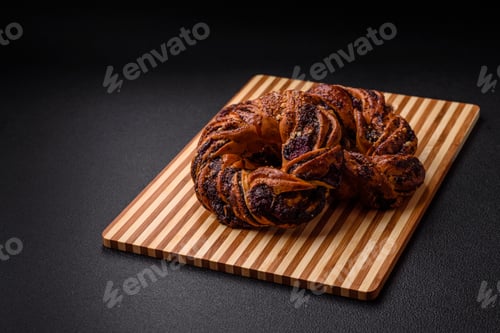 Preview: Delicious fresh baked bun with poppy seeds and berries