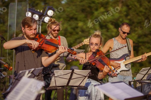 Preview: Musicians playing classic instrumental music at outdoor concert