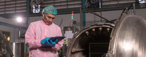 Preview: Worker Checking quality or checking stock of glass bottle in beverage factory.