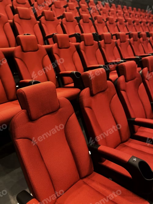 Preview: Red chairs in a cinema. Empty hall of red chairs. pandemic rules. Empty movie theater.