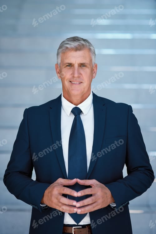 Preview: Hes a business mogul. Portrait of a mature businessman standing in an office.