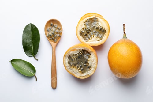 Preview: Ripe passion fruits, seeds and green leaves on white background, flat lay