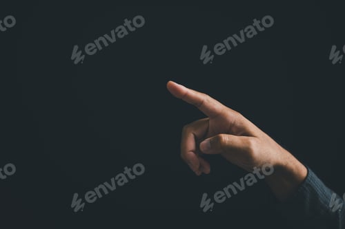 Preview: Hand pointing right, isolated on black background. Minimalist design concept.