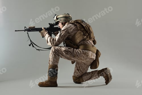 Preview: Soldier aiming at target indoors during military training session with weapon in hand