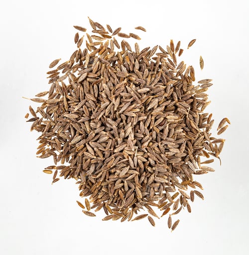 Preview: Aroma spice cumin is scattered on a white isolated background. Top view