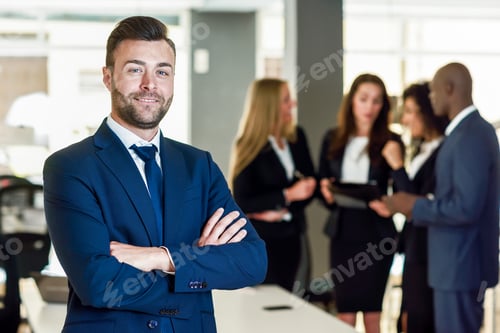 Preview: Businessman leader in modern office with businesspeople working