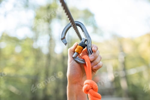 Preview: Climber fasten carbine on a rope