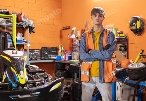 Preview: Young Man Poses Next to Go-Kart in Garage