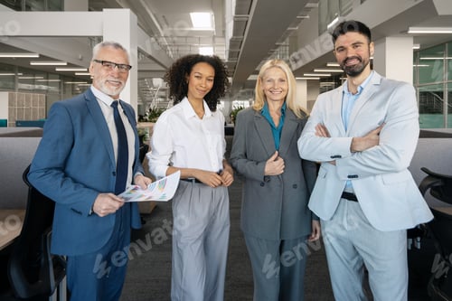 Preview: Successful business team posing in modern office environment