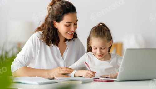Preview: Mother and Daughter Doing Homework Together at Home