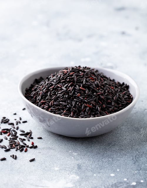 Preview: Black Wild Rice in a bowl. Grey background. Close up.