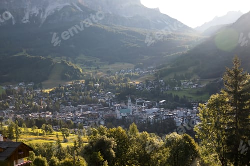 Preview: Cortina d'Ampezzo town panoramic view with alpine green landscape and massive Dolomites Alps