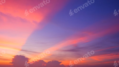 Preview: Evening sky background with colorful pink and orange spectacular light and cloud on blue sunset sky