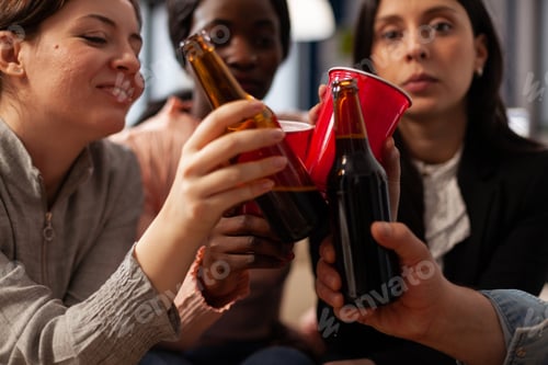 Preview: Business people clinking glasses and bottles of beer