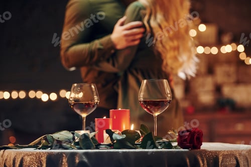 Preview: Standing and dancing. Young lovely couple have romantic dinner indoors together