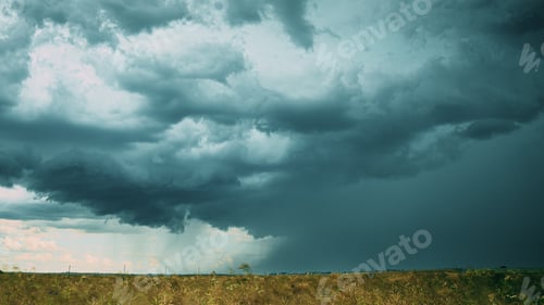 Preview: Storm Cloudy Rainy Sky. Dramatic Sky With Dark Clouds In Rainy Day. Storm And Rain Above Summer