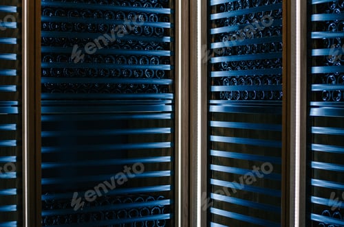 Preview: Wine bottles stored in a winery on the fermentation process