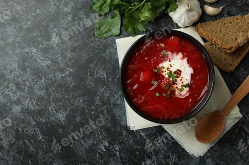 Preview: Concept of tasty eating with borscht on black smokey background