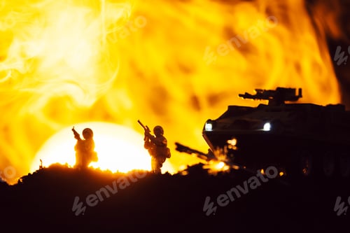 Preview: Scene of battle with toy warriors, tank and smoke with sunset at background